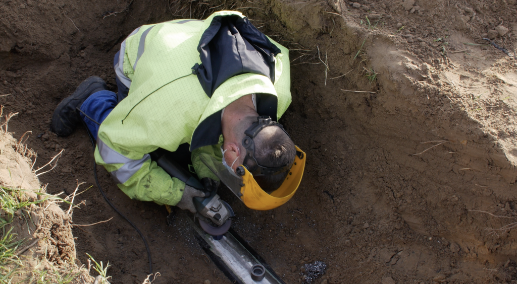 Real-time detection of mechanical impact on buried pipelines